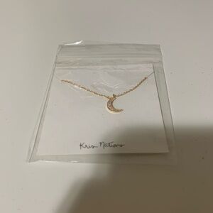 Gold tone kris nations moon necklace
